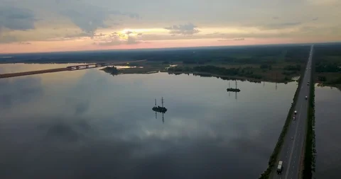 Sunset view from the top of the river with a bridge Stock Footage 98650548