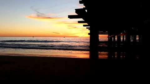 Sunset view from underneath the pier Stock Footage 82708406