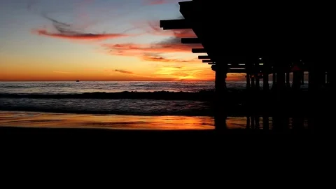 Sunset view from underneath the pier Stock Footage 82708409