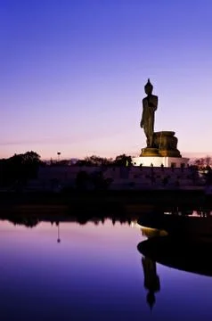 Sunset view of walking buddha Stock Photos
