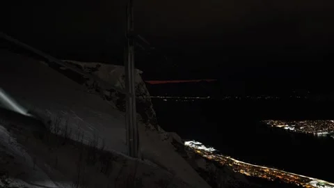 Sunset view whilst ascending snowy mountain in Fjellheisen cable car, Tromso Stock Footage 301467864