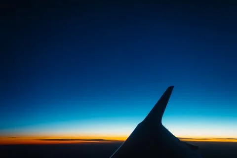 Sunset view from the window of an airplane Stock Photos