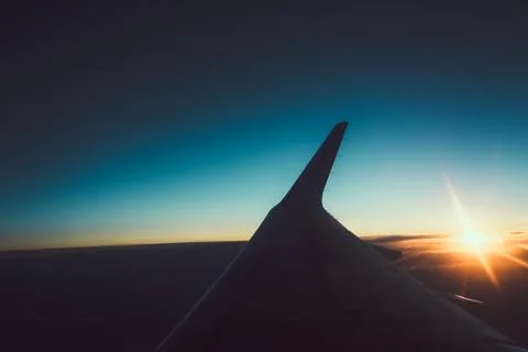Sunset view from the window of an airplane Stock Photos