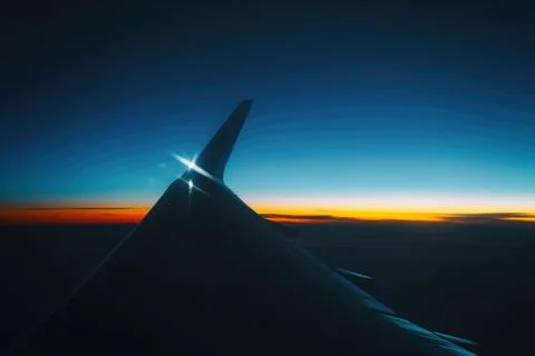 Sunset view from the window of an airplane Stock Photos