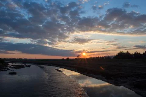 Sunset viewed from the bridge to Two Tree Island, Essex, England Stock Photos