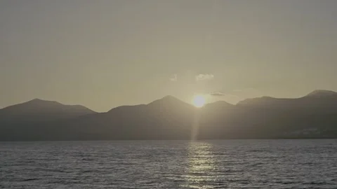 Sunset viewed from the sea, off the coast of Lanzarote 库存影片 327985191
