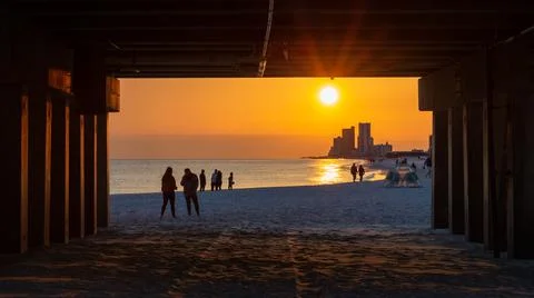 Sunset Viewed Through the Gulf State Park Pier Stock Photos