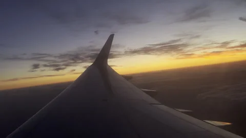 Sunset viewing from an airplane window Stock Footage 257293186