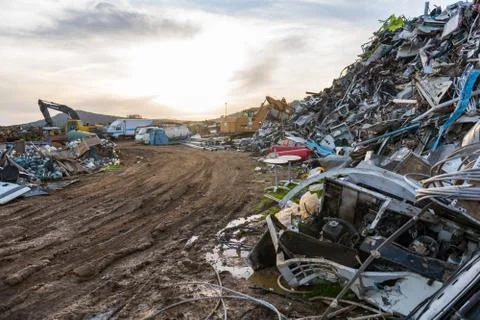 Sunset views of cranes working in a scrap yard near Sierra de Fuentes Stock Photos