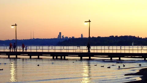 Sunset walk on the dock Video stock 79751215