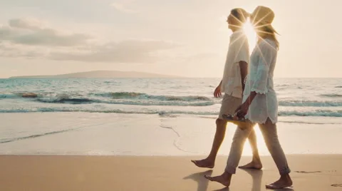 Sunset Walk on a Luxury Beach. Happy Retired Couple on Tropical Vacation. Video stock 57714957