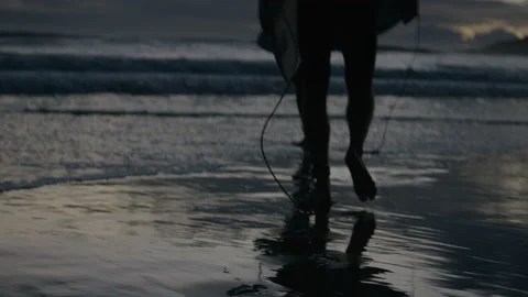Sunset walking along beach with surfboards Stock Footage 169242777