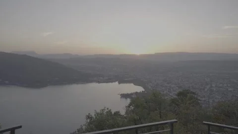 Sunset Warm Tones: Handheld Horizontal View of Lake Annecy and the City Annecy Stock Footage 265100983