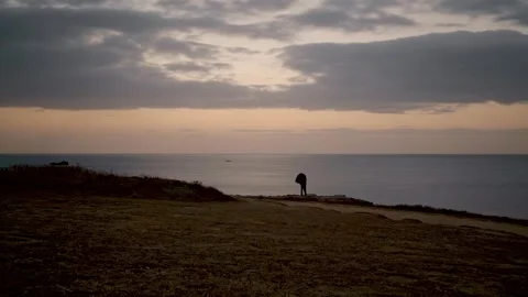 Sunset Watch: A Time-Lapse of Dusk at the Seaside Cliff Stock Footage 260836695