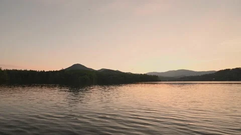 Sunset on the Water In the Mountains Stock Footage 137866686