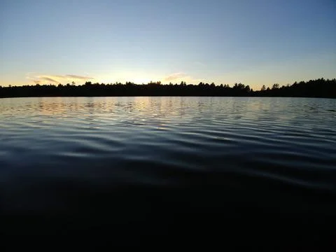 Sunset on water 库存照片