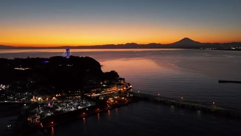 Sunset Water Reflection | Enoshima | Mt. Fuji - 4K Aerial Video Stock Footage 329055057