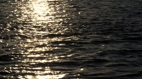Sunset on the water with shimmering reflection Stock Footage 72987723