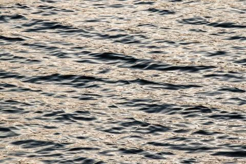 Sunset water waves background pattern Stock Photos