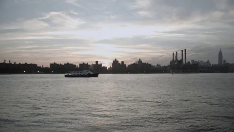 Sunset. Waterfront view. Manhattan skyline. Cruise boat on East River. New York. Stock Footage 75266786