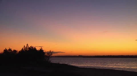 Sunset on waterway, 12fps @75% Stock Footage 24638477