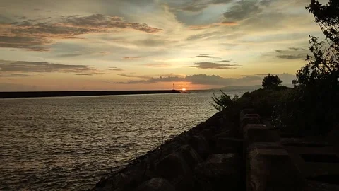 Sunset on the wave wall Steam Power Plant Video stock 276099819