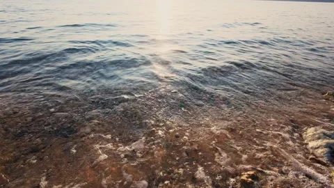 Sunset Waves Breaking on the Rocky Coastline Stock Footage 311963129