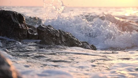 Sunset Waves Crashing Against Rocky Coastline With Foamy Ocean Surf Stock Footage 337306855