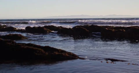 Sunset Waves Crashing on Beach in Southern California Stock Footage