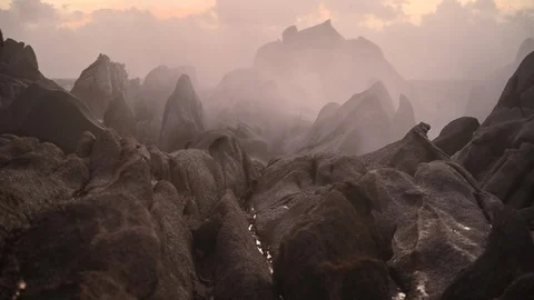 Sunset waves crashing on the rocks during a storm Stock Footage 125056425