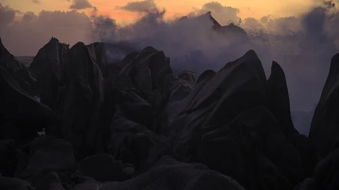 Sunset waves crashing on the rocks during a storm Stock Footage 126172119