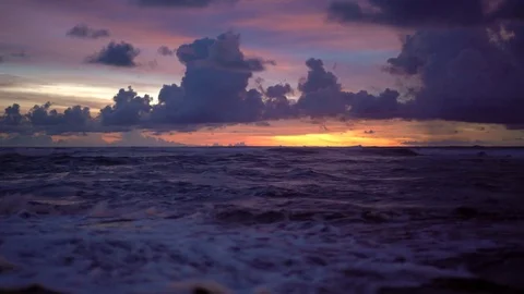 Sunset with waves flowing over a tide pool Stock Footage 74290100