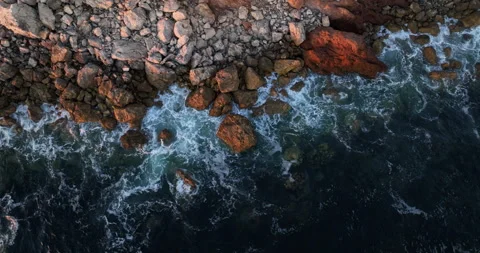Sunset Waves hitting Beach - Land Meets Sea- Ocean and Cliffs Stockbeeldmateriaal 243538028