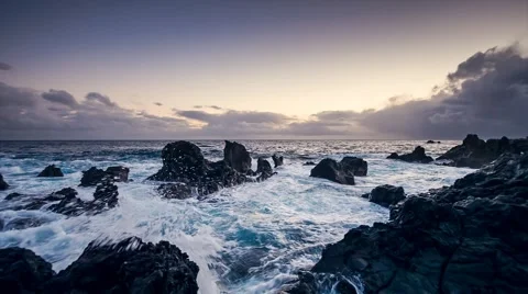 Sunset with waves hitting the rocks Stock Footage 42576179