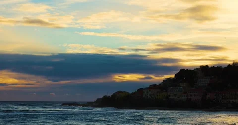 Sunset on the waves on an Italian beach Stock Footage 243420508