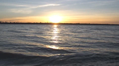 Sunset waves lapping at shore Video stock 37140148