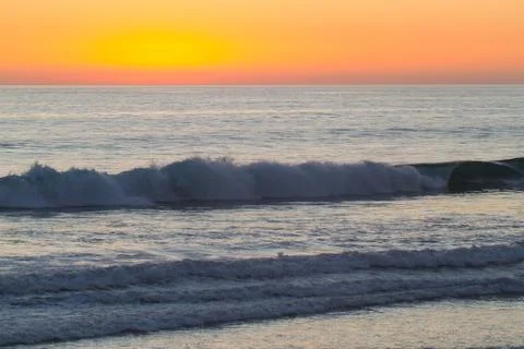 Sunset with Waves Stock Photos