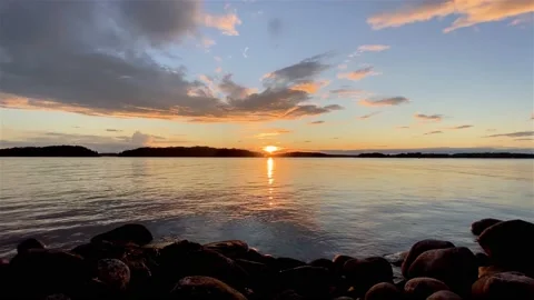 Sunset - Waves - Rocks - Archipelago - Seamless Loop Stock Footage 134982651