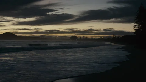 Sunset as the waves roll in Stock Footage 169241955