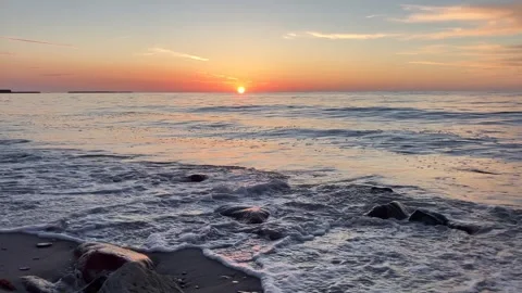 Sunset Waves Rolling Across Sandy Beach Stock Footage 341934744