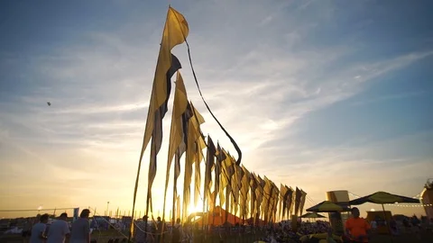 At sunset, the waving of flags on open air. Stock Footage 127039444