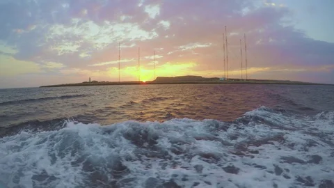 Sunset on waving sea, view from deck of moving ship Stock Footage 95700896