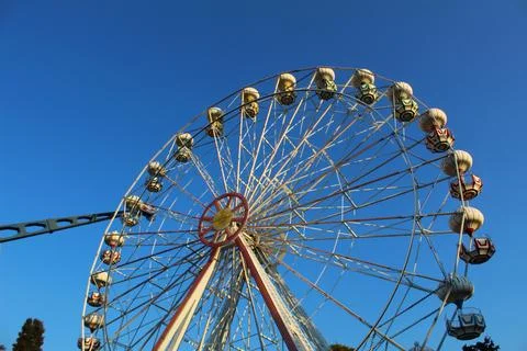 Sunset Whimsy: Ferris Wheel Magic in the Amusement Park Stock Photos