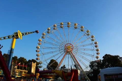 Sunset Whimsy: Ferris Wheel Magic in the Amusement Park Stock Photos
