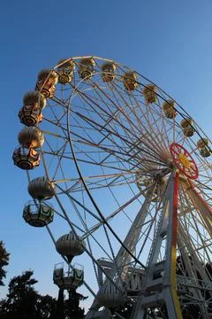 Sunset Whimsy: Ferris Wheel Magic in the Amusement Park Stock Photos