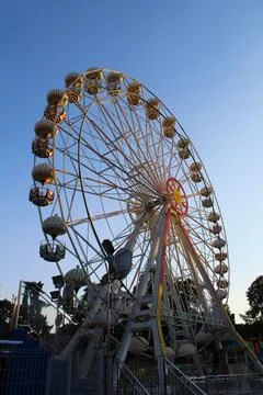 Sunset Whimsy: Ferris Wheel Magic in the Amusement Park Stock Photos