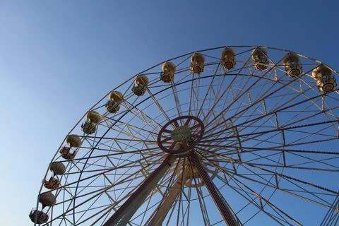 Sunset Whimsy: Ferris Wheel Magic in the Amusement Park Stock Photos