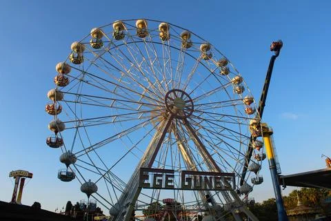 Sunset Whimsy: Ferris Wheel Magic in the Amusement Park Stock Photos