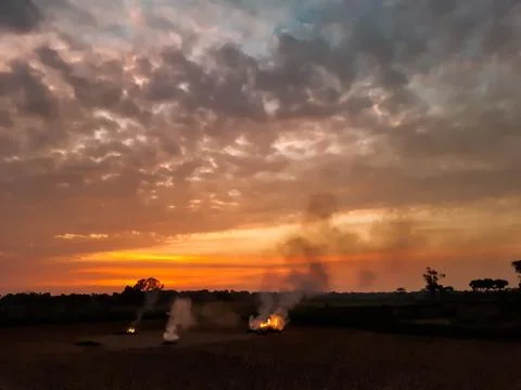 At sunset, the white clouds in the blue sky, the sun's light turned red and s Stock Photos
