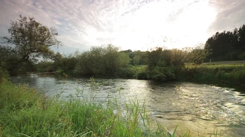 A Sunset wide shot of a small creek Stock Footage 86762289